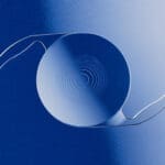 A blue background with a white bowl and two wires.